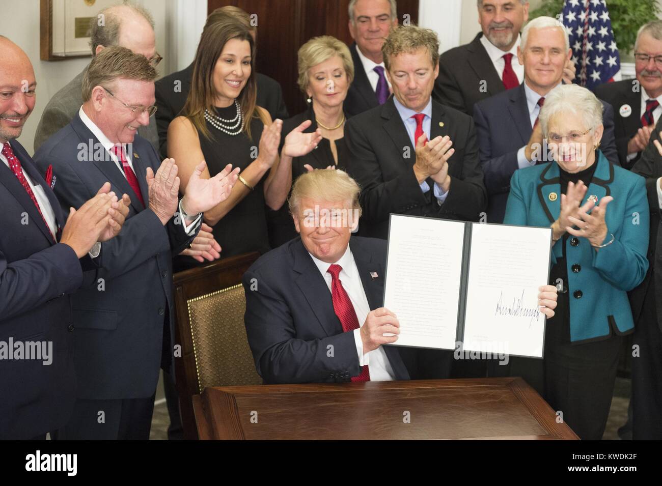 President Donald Trump signs the Executive Order to Promote Healthcare Choice and Competition. Oct. 12, 2017. The order allows American employers to form health insurance groups across state lines (BSLOC 2017 18 168) Stock Photo