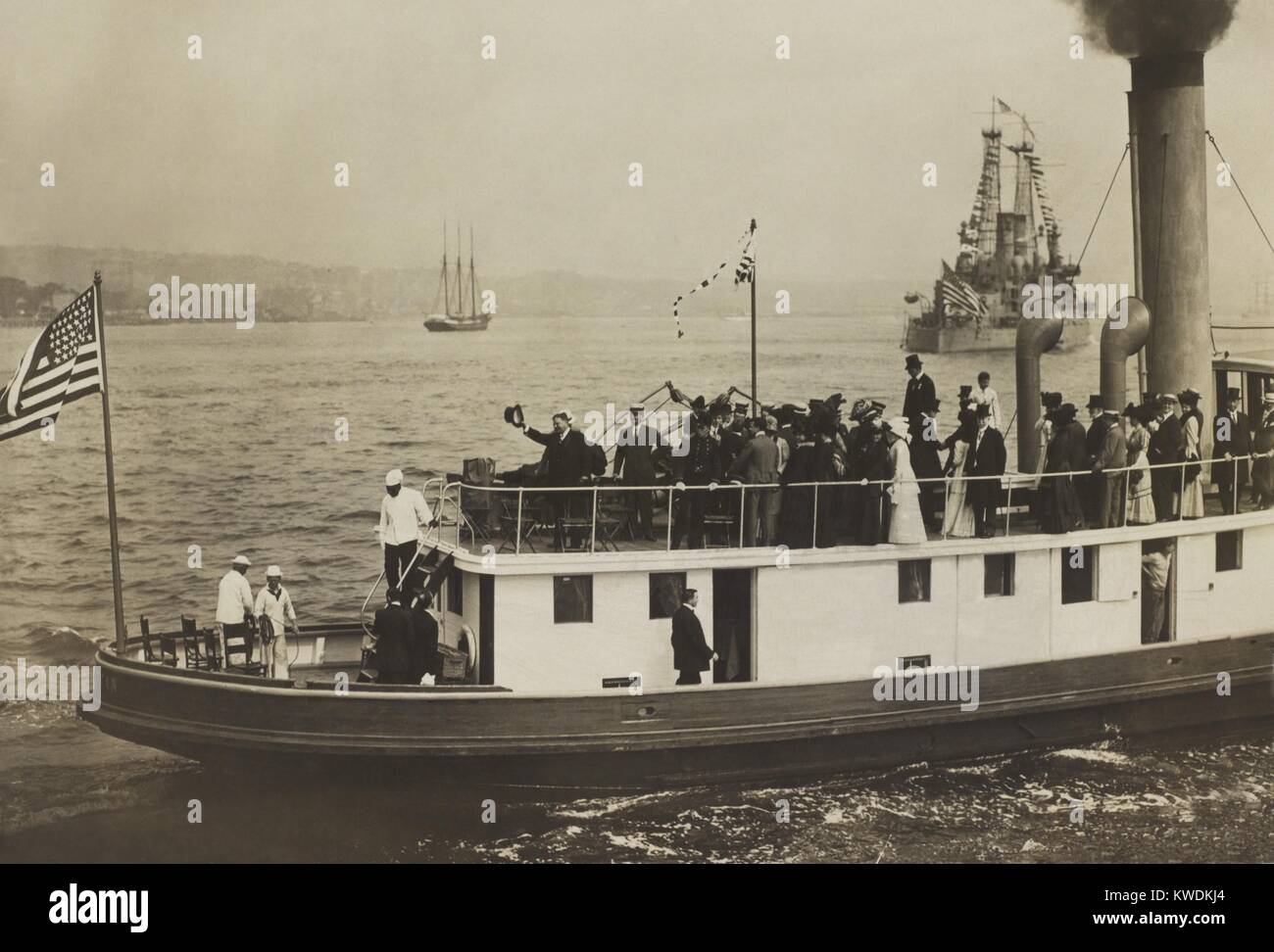 Enlarged details of Theodore Roosevelt (waving hat) and young Franklin and Eleanor Roosevelt. They are on the ferry boat, Androscoggin, in NYC Harbor, June 18, 1910 during Theodores welcome home after 9 months abroad in Africa and Europe (BSLOC 2017 8 21) Stock Photo