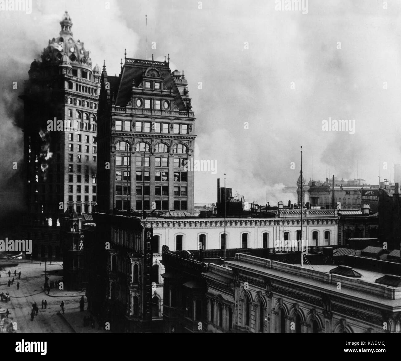 3-day fire that followed the San Francisco Earthquake at Kearny, Third, Market, and Geary Streets. Flames can be seen coming from the windows of the Call Building at far left. The Mutual Bank Building and other structures in the foreground would also be consumed by the fire (BSLOC 2017 17 11) Stock Photo