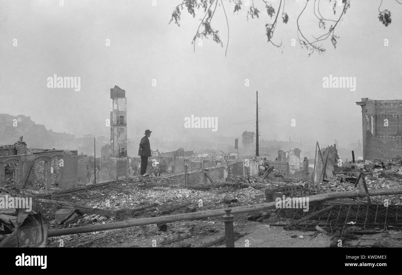 A Chinese man stands in the ruins of San Franciscos Chinatown after the April 18, 1906 earthquake. The Chinese community had to fight to be allowed to rebuild in their traditional neighborhood after the disaster. Photo by Arnold Genthe (BSLOC 2017 17 33) Stock Photo