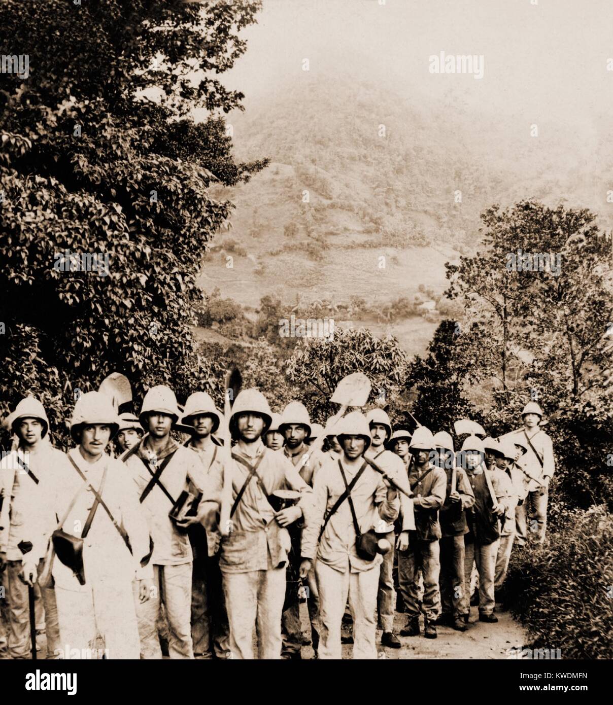 French soldiers, bound for the village of Morne Rouge, destroyed by a volcanic eruption of Mt. Pelee. They are a burial party to attend to the 2000 killed on Aug. 30, 1902 on Martinique, French West Indies (BSLOC 2017 17 65) Stock Photo