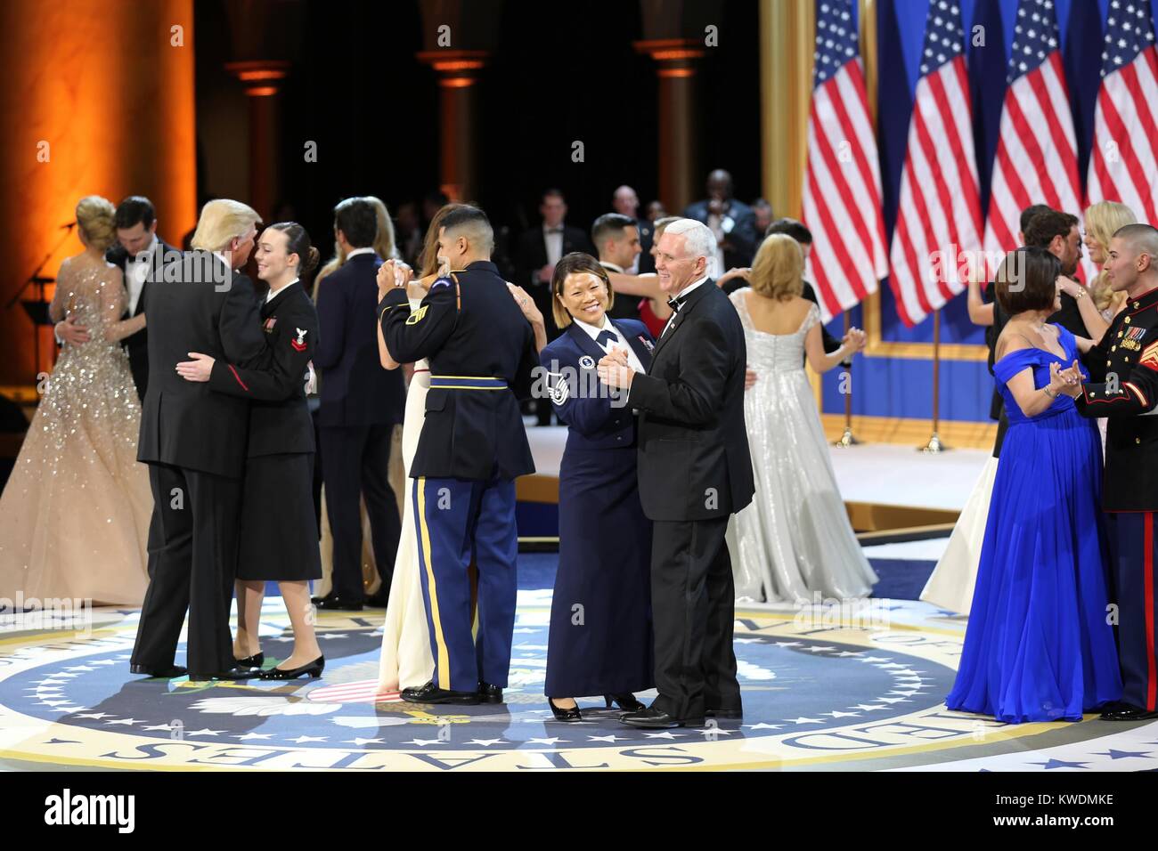 President Donald Trump, VP Mike Pence, and wives dance with the military and first responders. They are at the Salute to Our Armed Services Ball at the National Building Museum in Washington, D.C., Jan. 20, 2017 (BSLOC 2017 18 126) Stock Photo