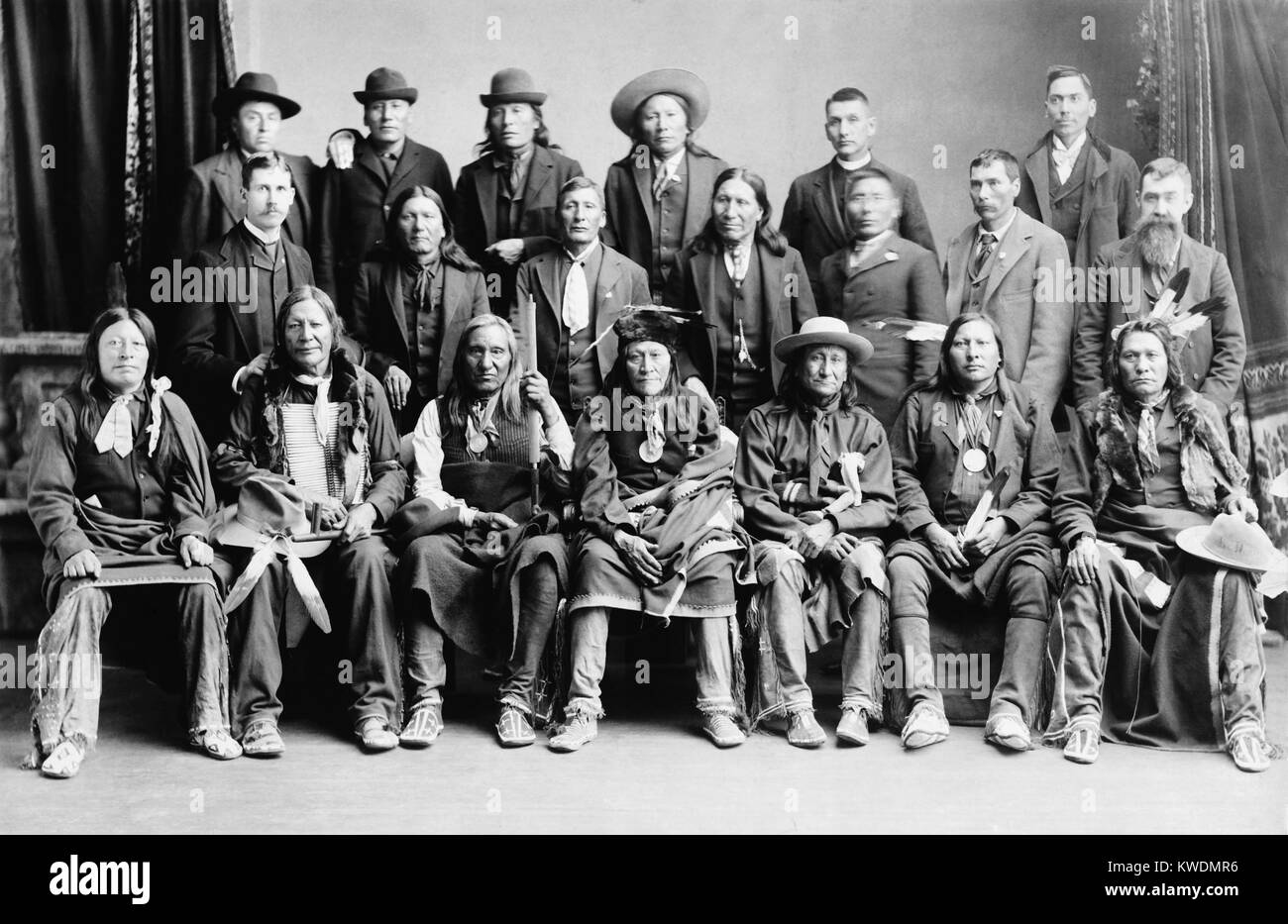 Sioux delegation in Washington, D.C., photographed by Charles Bell in 1891. After they signed a Peace Treaty with US Government after the Wounded Knee Massacre of Dec. 29, 1890, they traveled to Washington as a delegation. Front Row, L-R: High Hawk, Fire Lightning, Little Wound, Two Strike, Young-Man-Afraid-Of-His-Horses, Spotted Elk, and Big Road. Second Row, 4th from left is American Horse (BSLOC 2017 18 30) Stock Photo