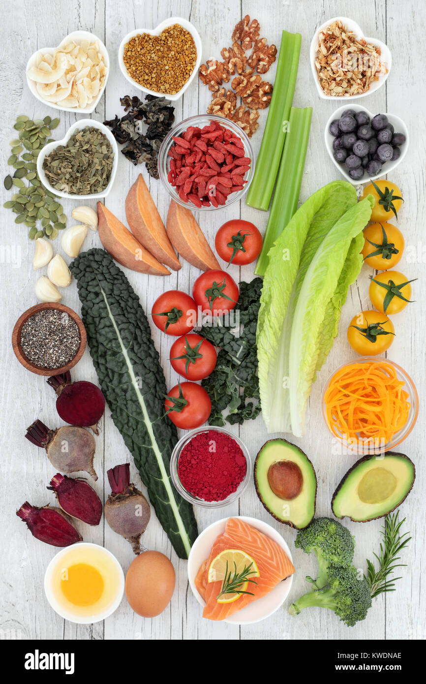 Brain boosting health food concept with fish, vegetables, seeds, nuts