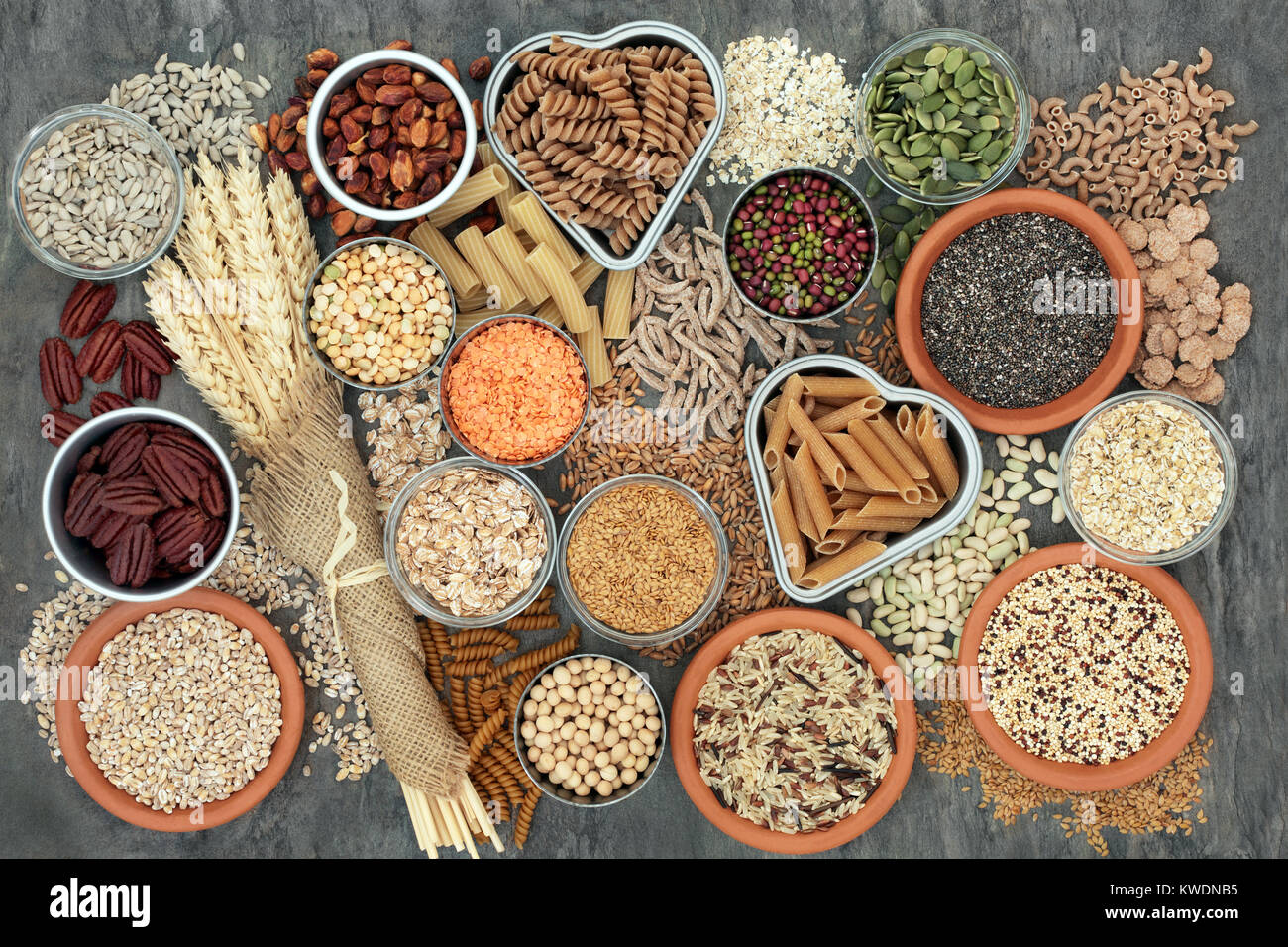 Healthy high fibre dietary food with whole wheat pasta, legumes, nuts, seeds, cereals, grains