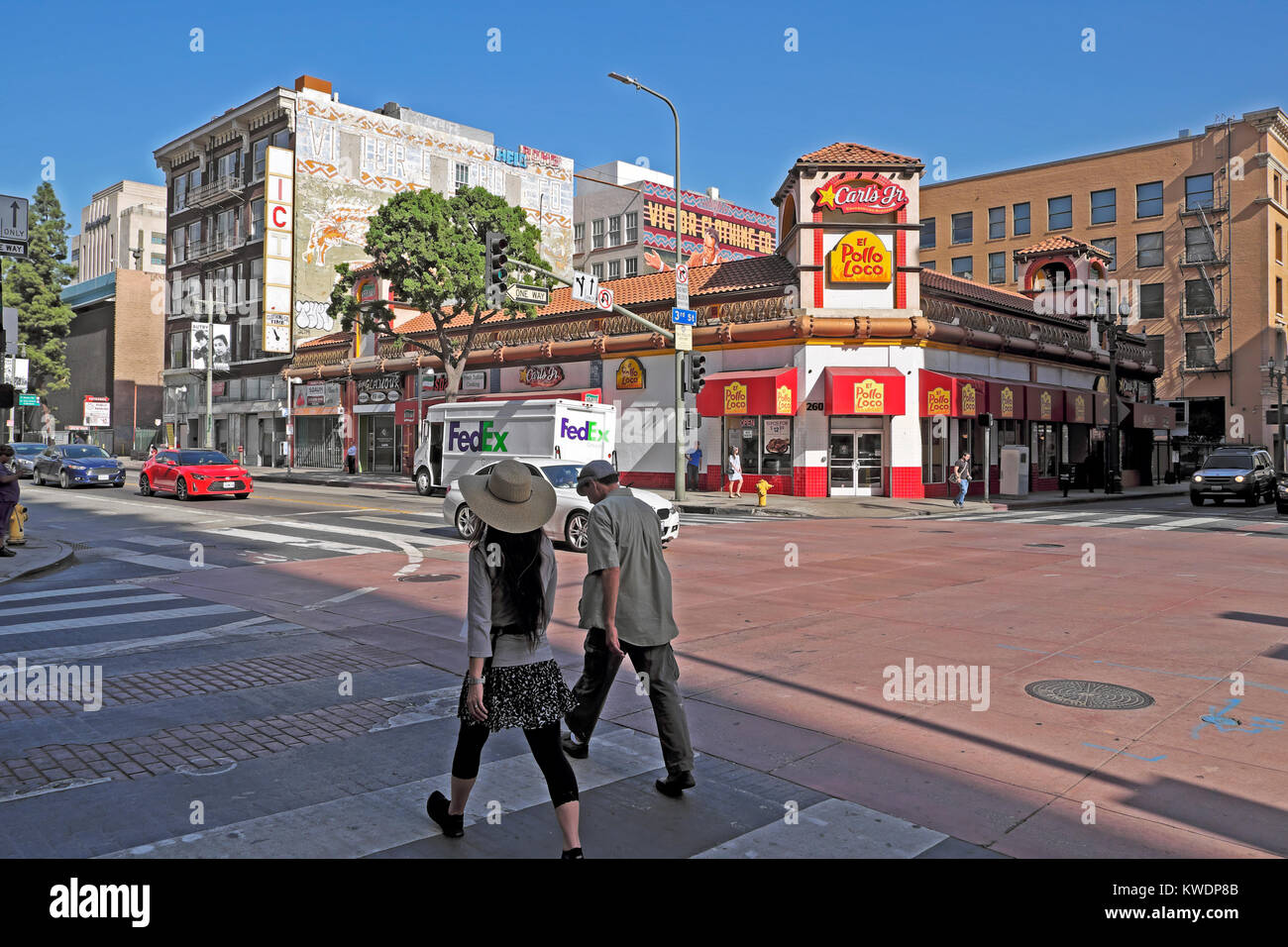 People pedestrians walking along S Broadway Avenue near El Pollo Loco Mexican restaurant in downtown Los Angeles California, USA  KATHY DEWITT Stock Photo