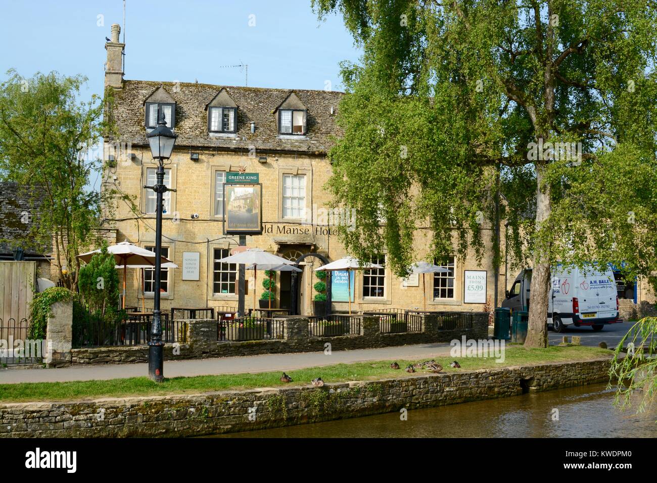 Looking across the River Windrush at the Old Manse Hotel in Bourton on the water