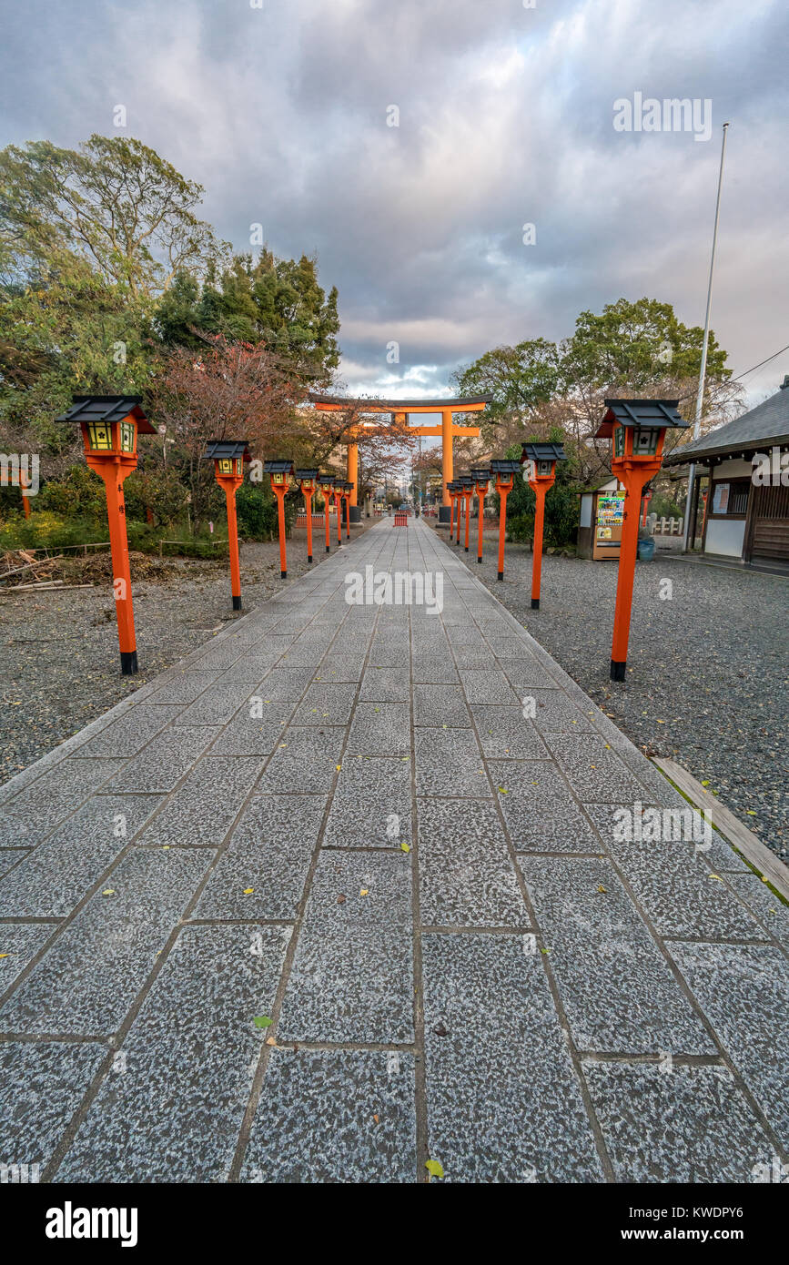 Kyoto, Japan - November 09, 2017 : Entrance Torii gate and lanterns (Tourou) at Hirano Jinja Shinto Shrine. Built in 17th century, Kasuga Jinja style. Stock Photo