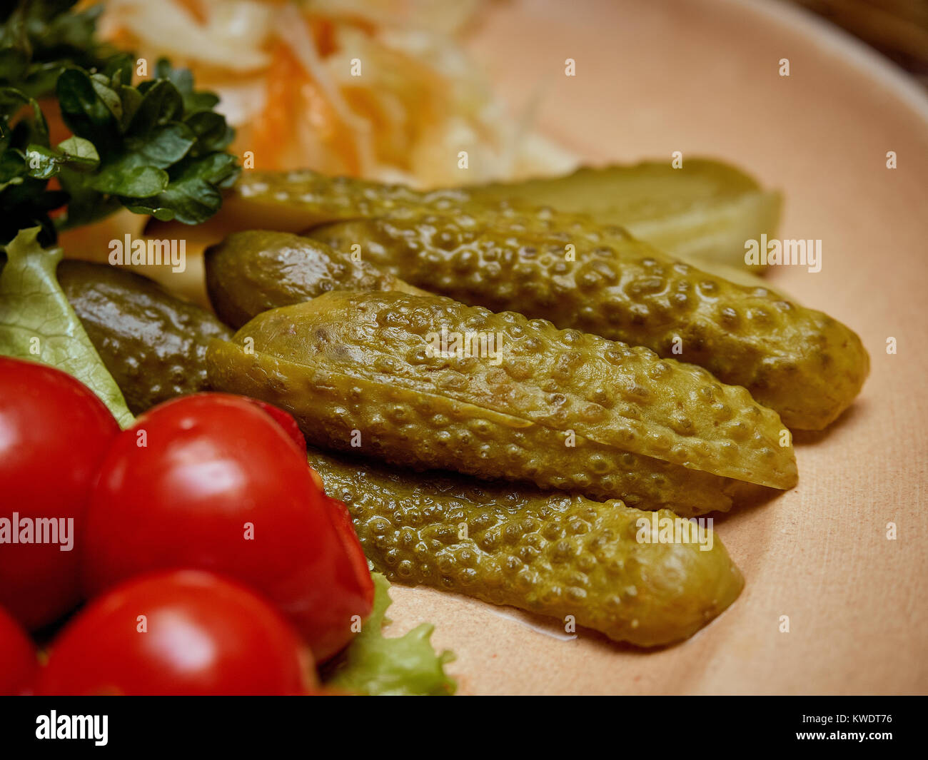 Finely chopped pickled vegetables are nicely laid out on a plate. Stock Photo