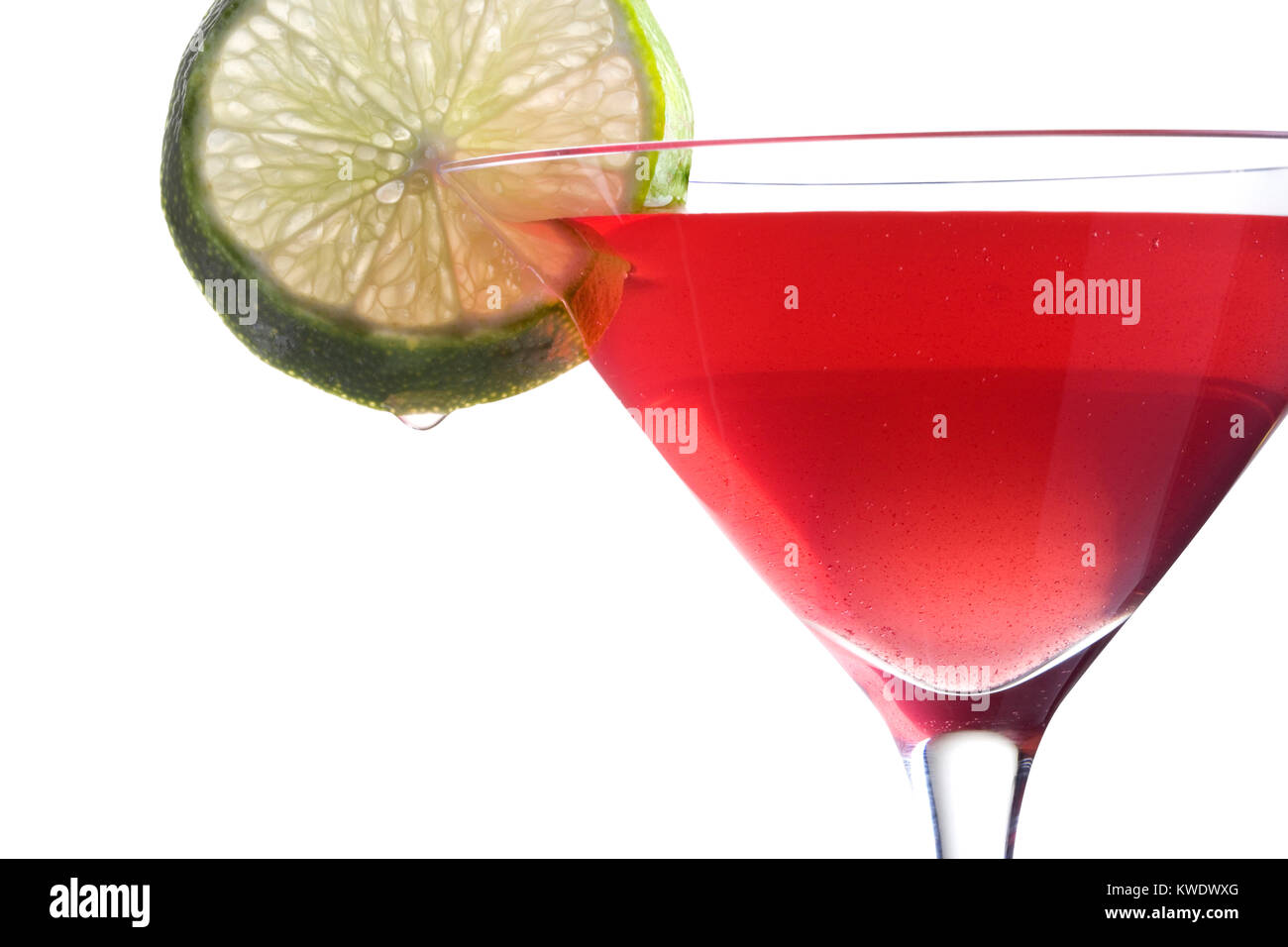 Cosmopolitan Cosmo mixed drink with lime slice on white background close up Stock Photo