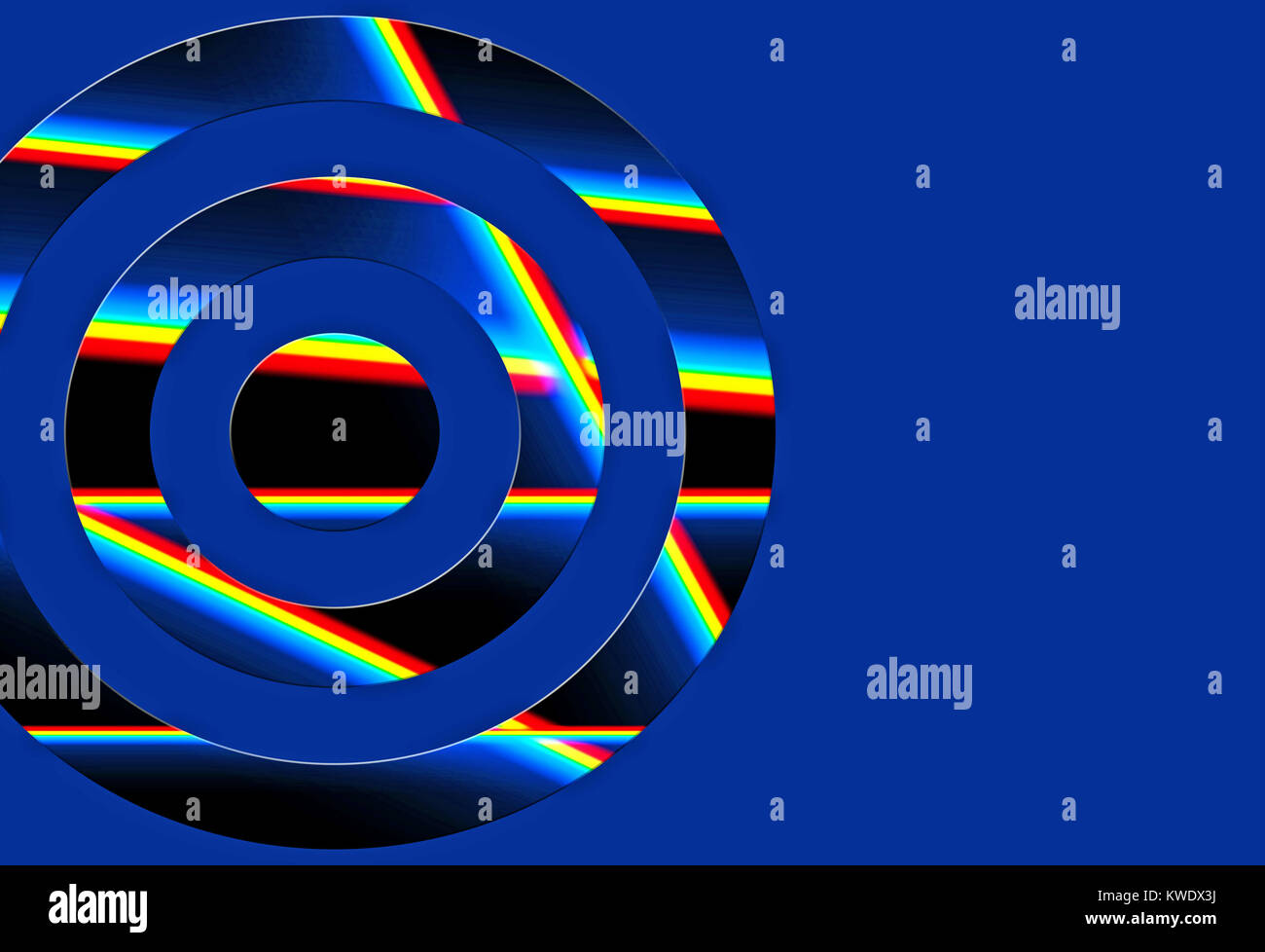 Prisms of light within a cut out circle on a vibrant blue background Stock Photo