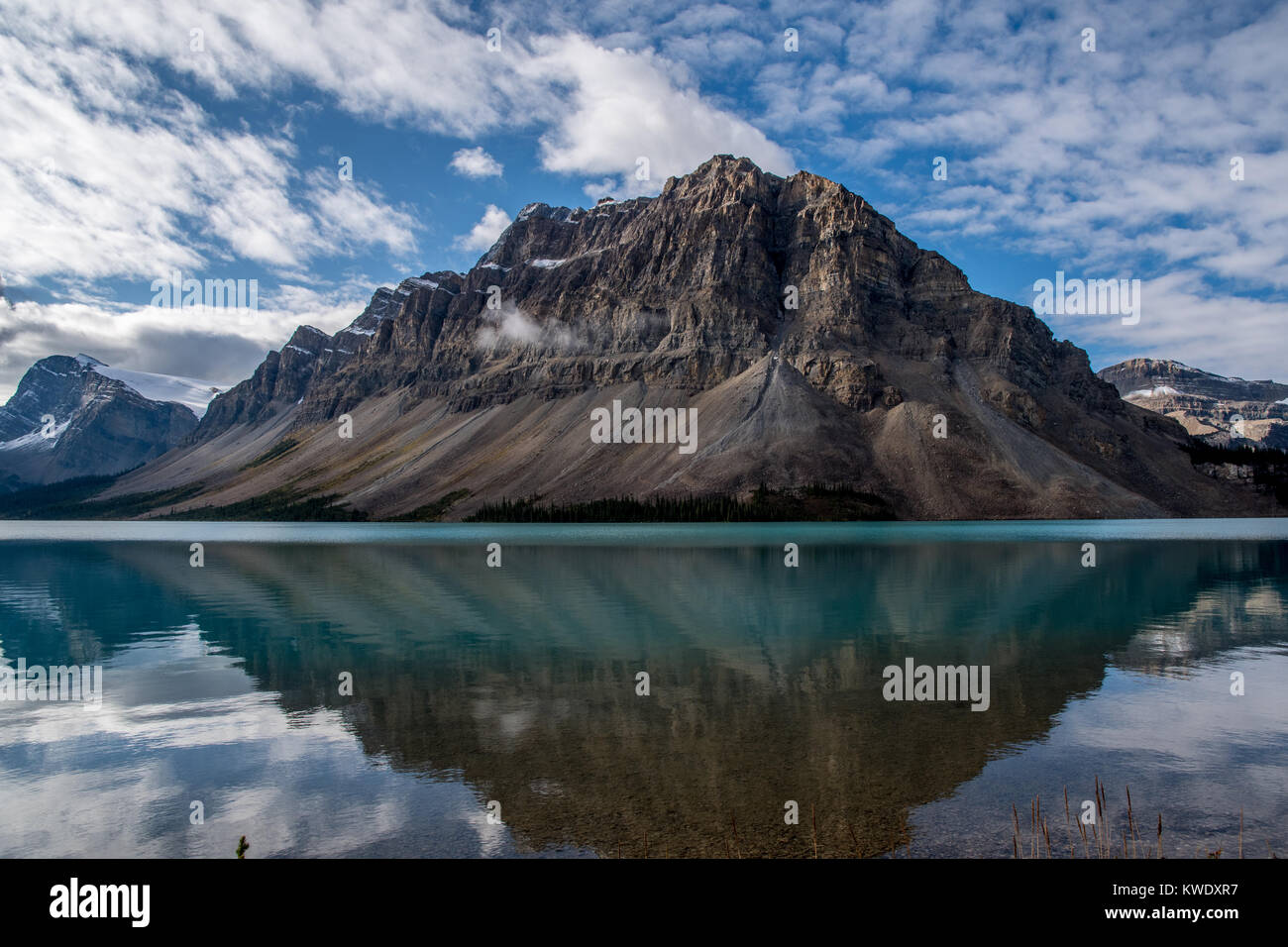 Mountain reflected in clear water of Bow Lake Stock Photo