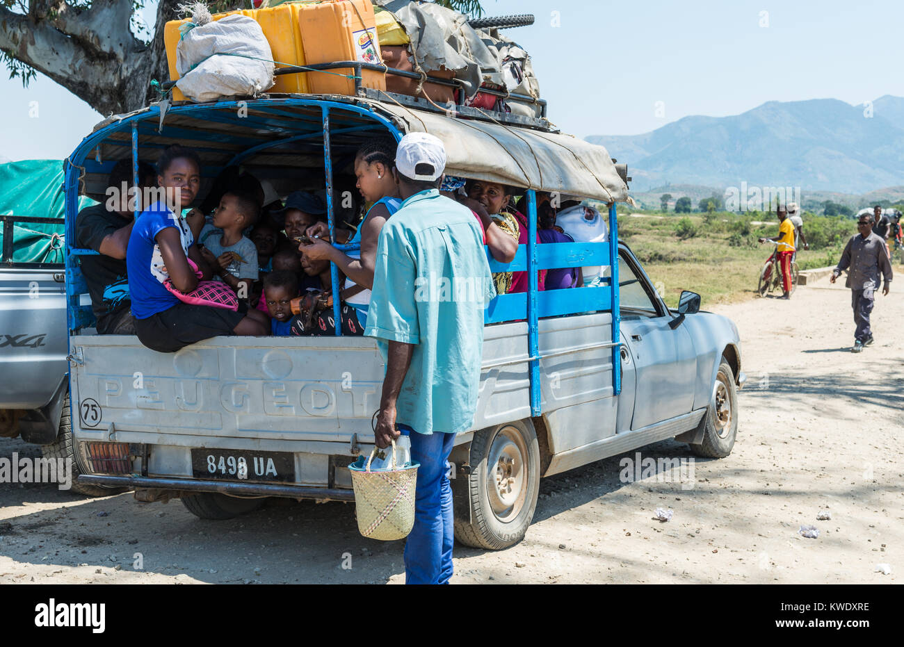 A small pickup truck used to transport locals on a dirt road. Madagascar, Africa. Stock Photo