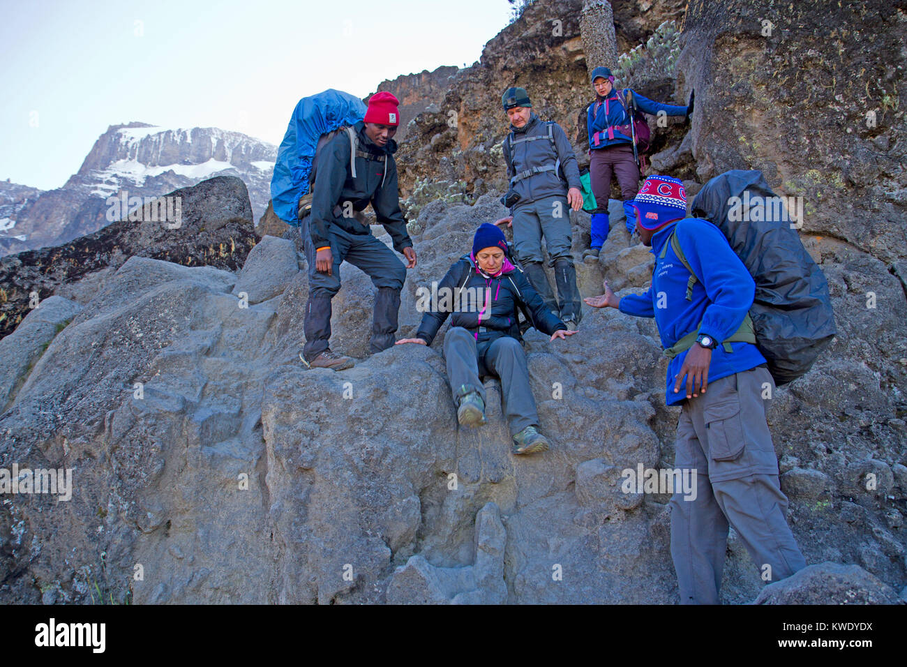 Trekkers on the Barranco Wall on Mt Kilimanjaro Stock Photo