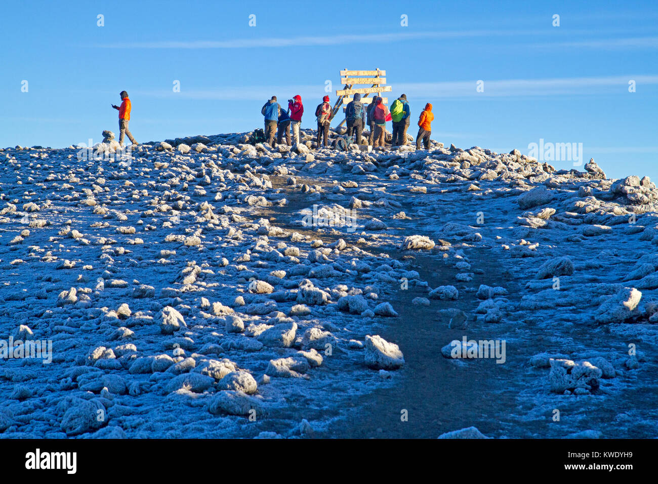 Trekkers on Uhuru Peak, the highest point on Mt Kilimanjaro Stock Photo