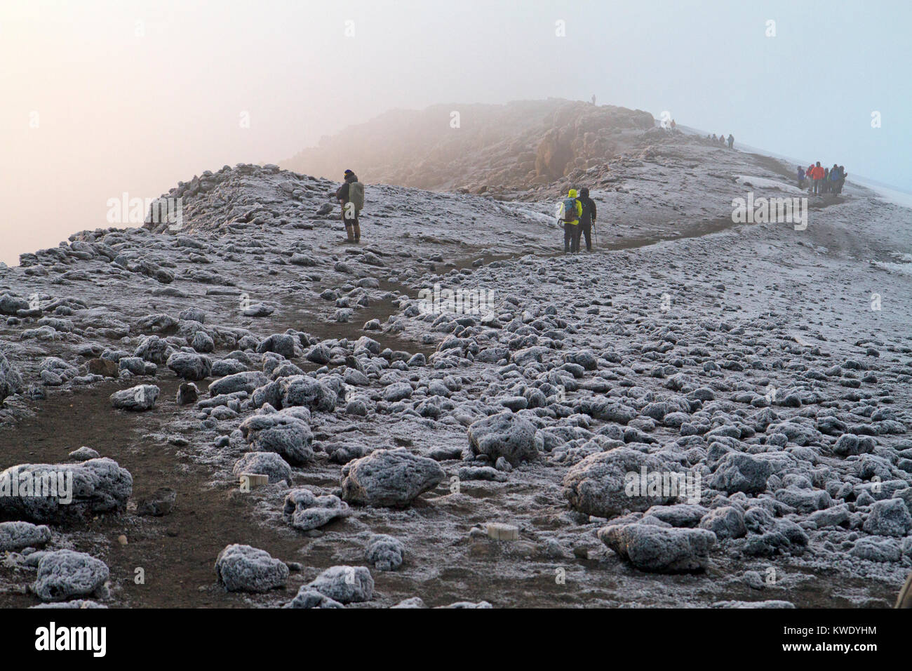 Trekkers approaching the summit of Mt Kilimanjaro Stock Photo