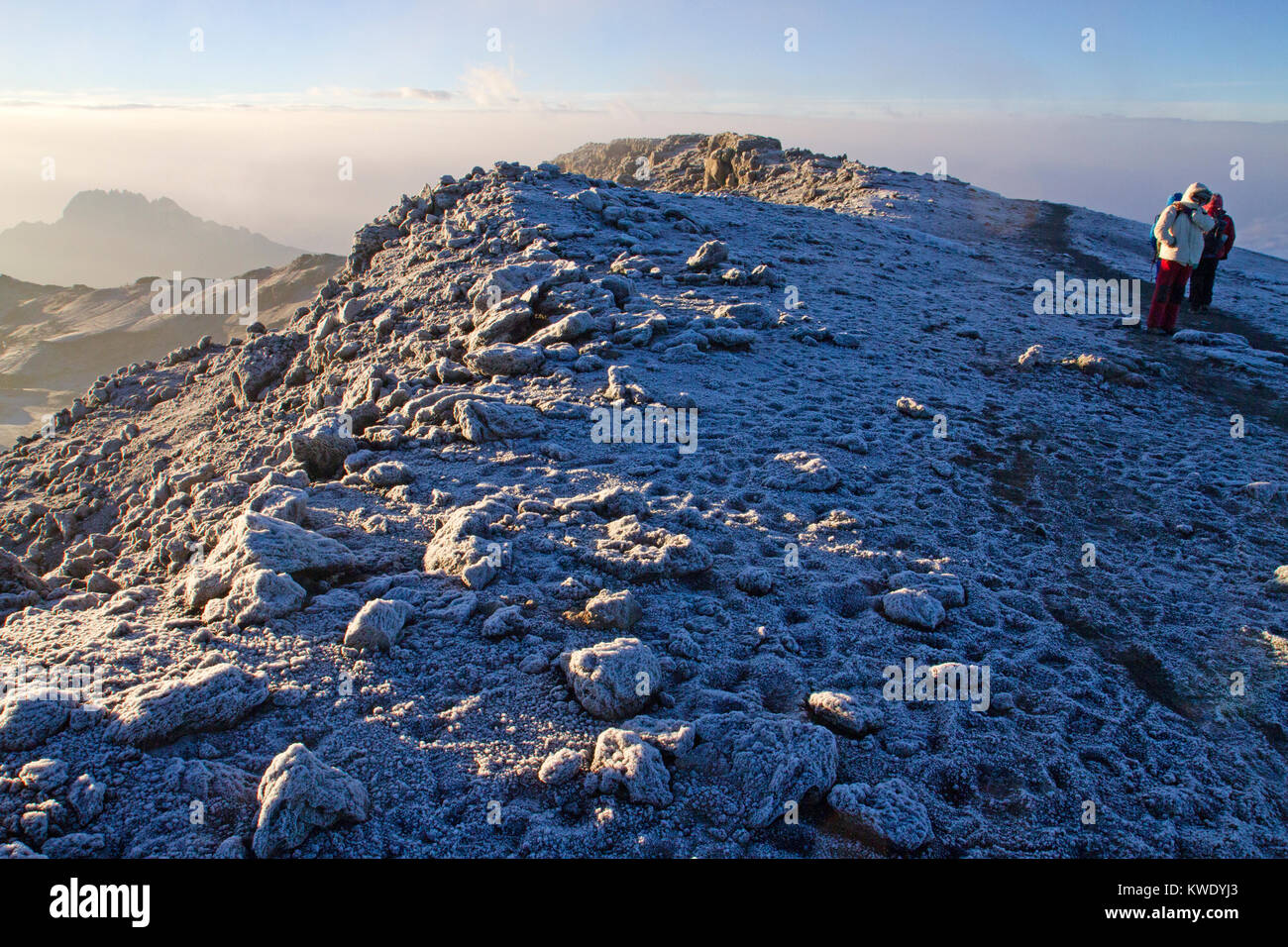 Trekkers approaching the summit of Mt Kilimanjaro Stock Photo