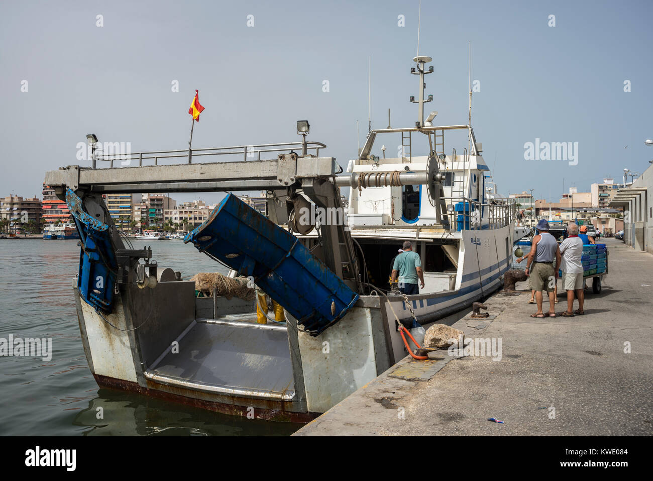 Fishing boats unloading fish in the port of Santa Pola, Alicante, Spain, on July 21, 2016 Stock Photo