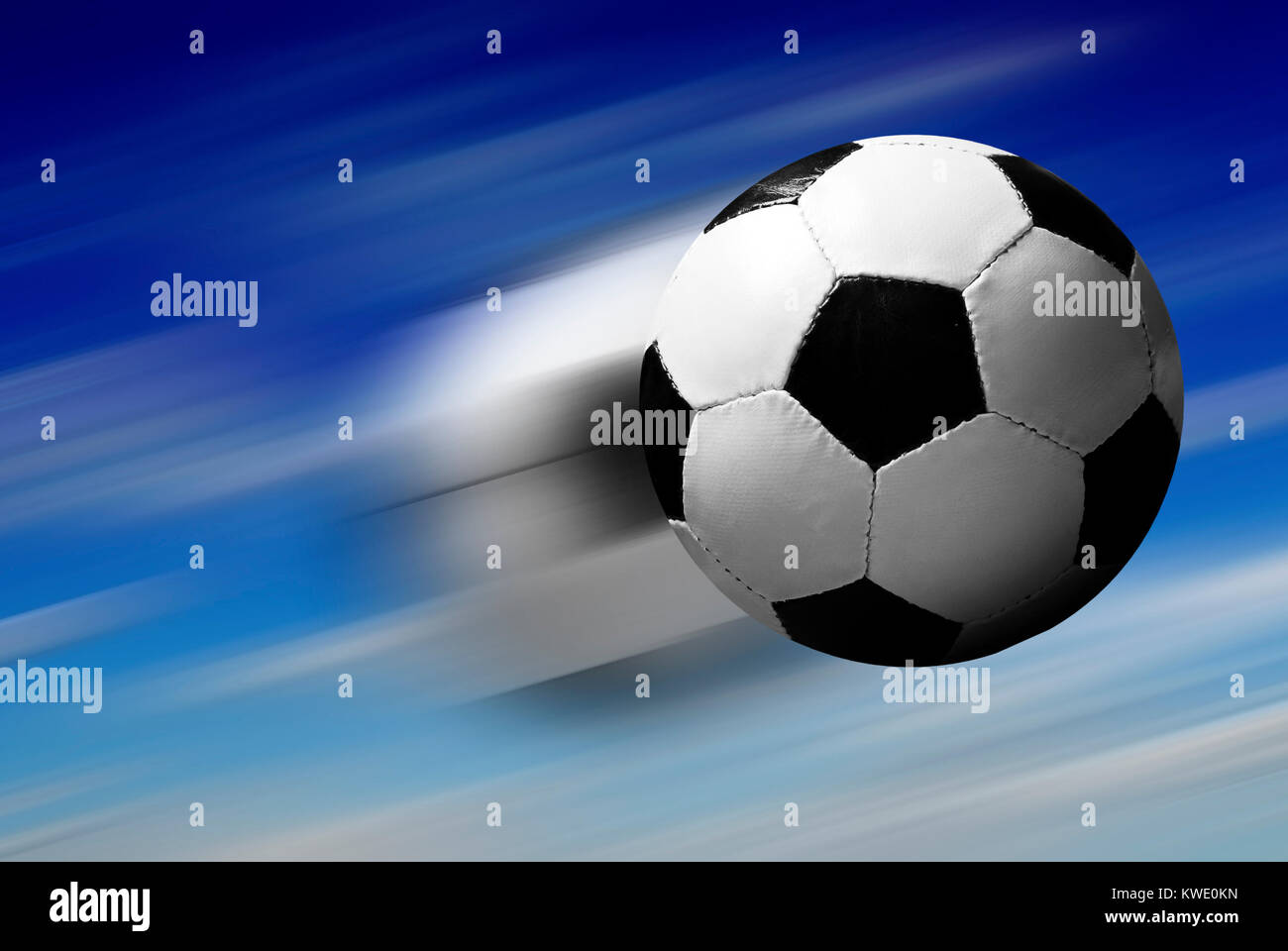 Football Or Soccer Shot With A Neutral Design Ball Being Kicked, With  Motion Blur On The Foot And Natural Background Stock Photo, Picture and  Royalty Free Image. Image 27280599.
