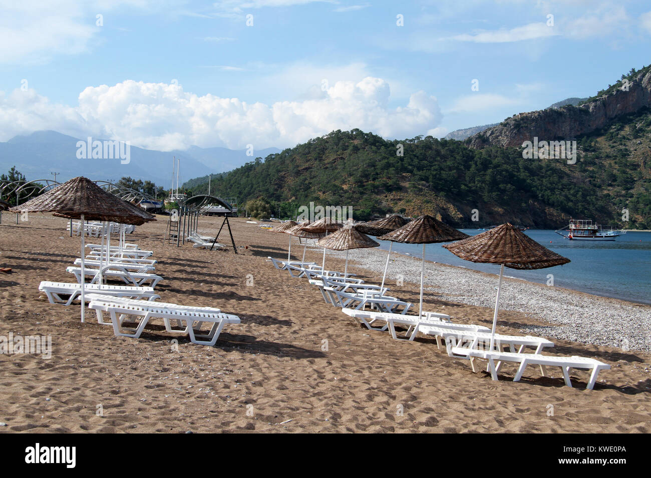Sand beach with umbrellas in Adrasan, Turkey Stock Photo