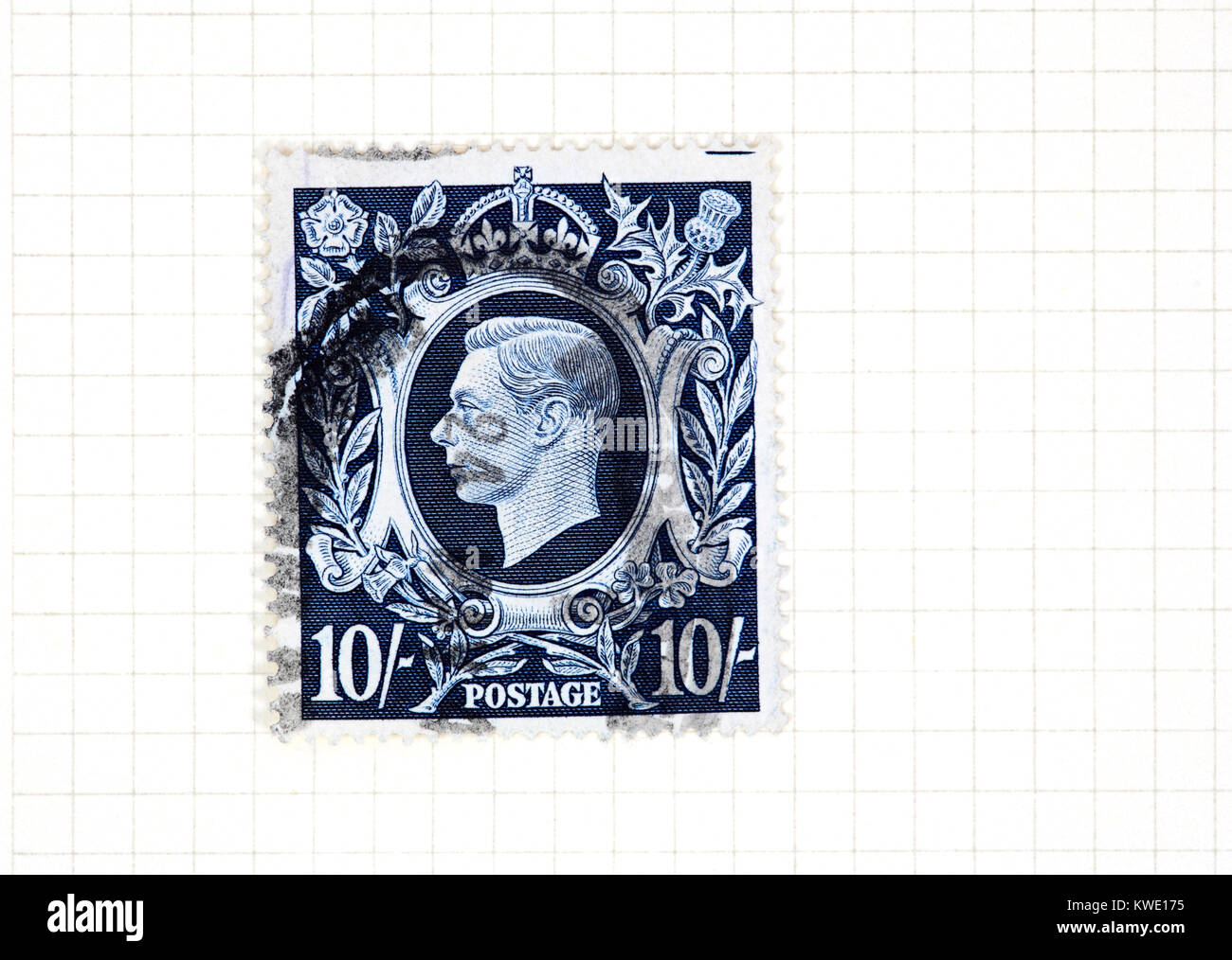 A used King George VI 10s dark blue stamp of 1939-48 issue from a collection of British stamps. Stock Photo