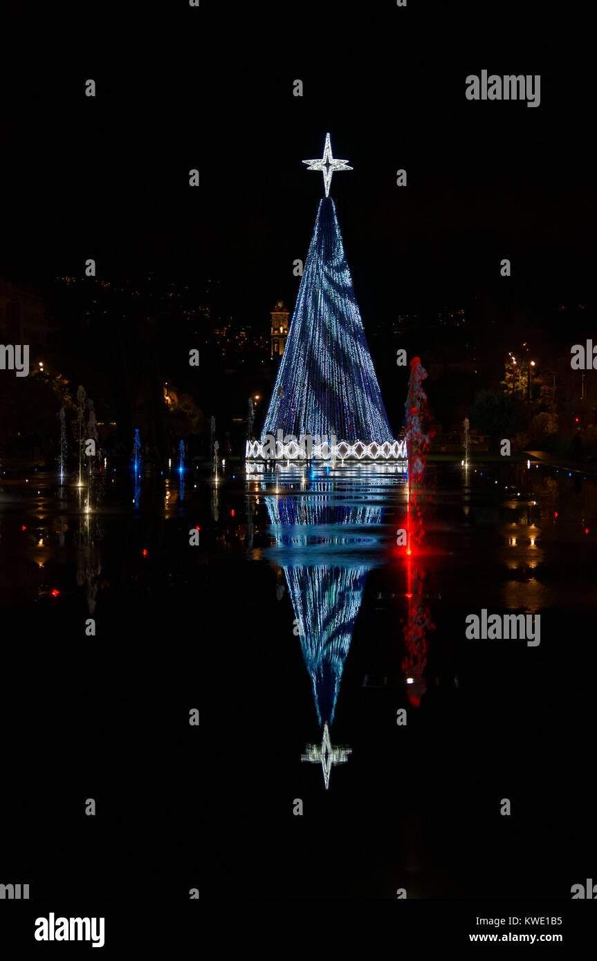 Christmas decoration reflecting in the water mirror in Nice (french riviera) Stock Photo
