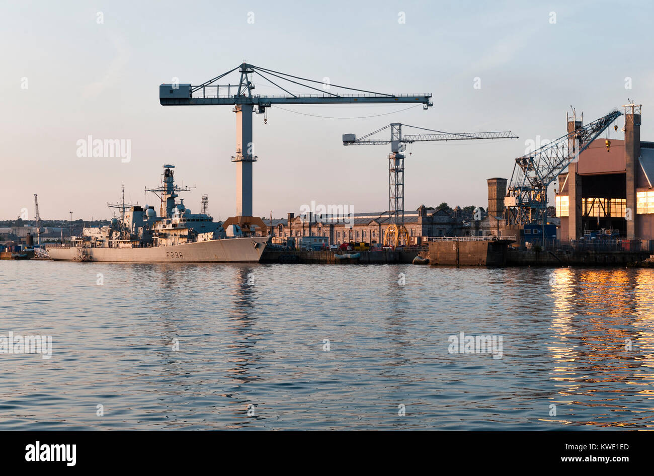 The Devonport Royal Dockyard, Plymouth, Devon, UK with HMS Montrose, a Type 23 frigate of the Royal Navy. Stock Photo