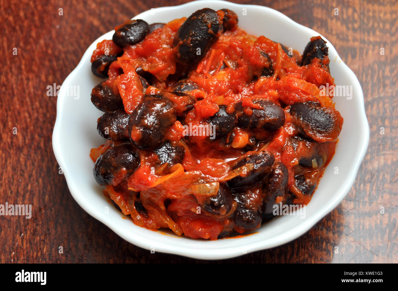 Vegetarian dish of stewed carrot and black beans with a tomato sauce in