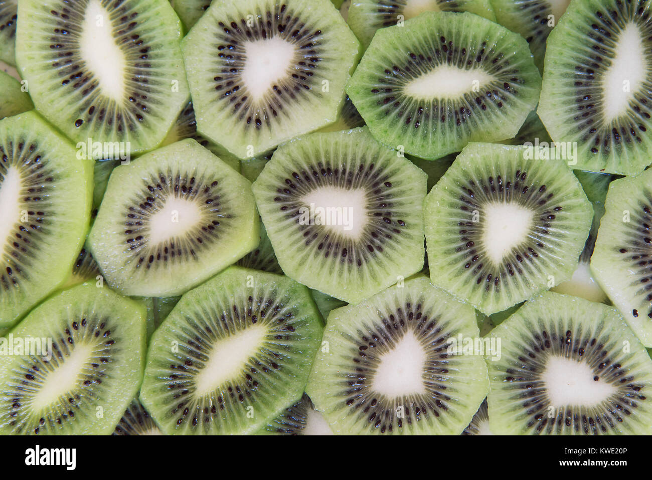 green slices of kiwi fruit texture background Stock Photo