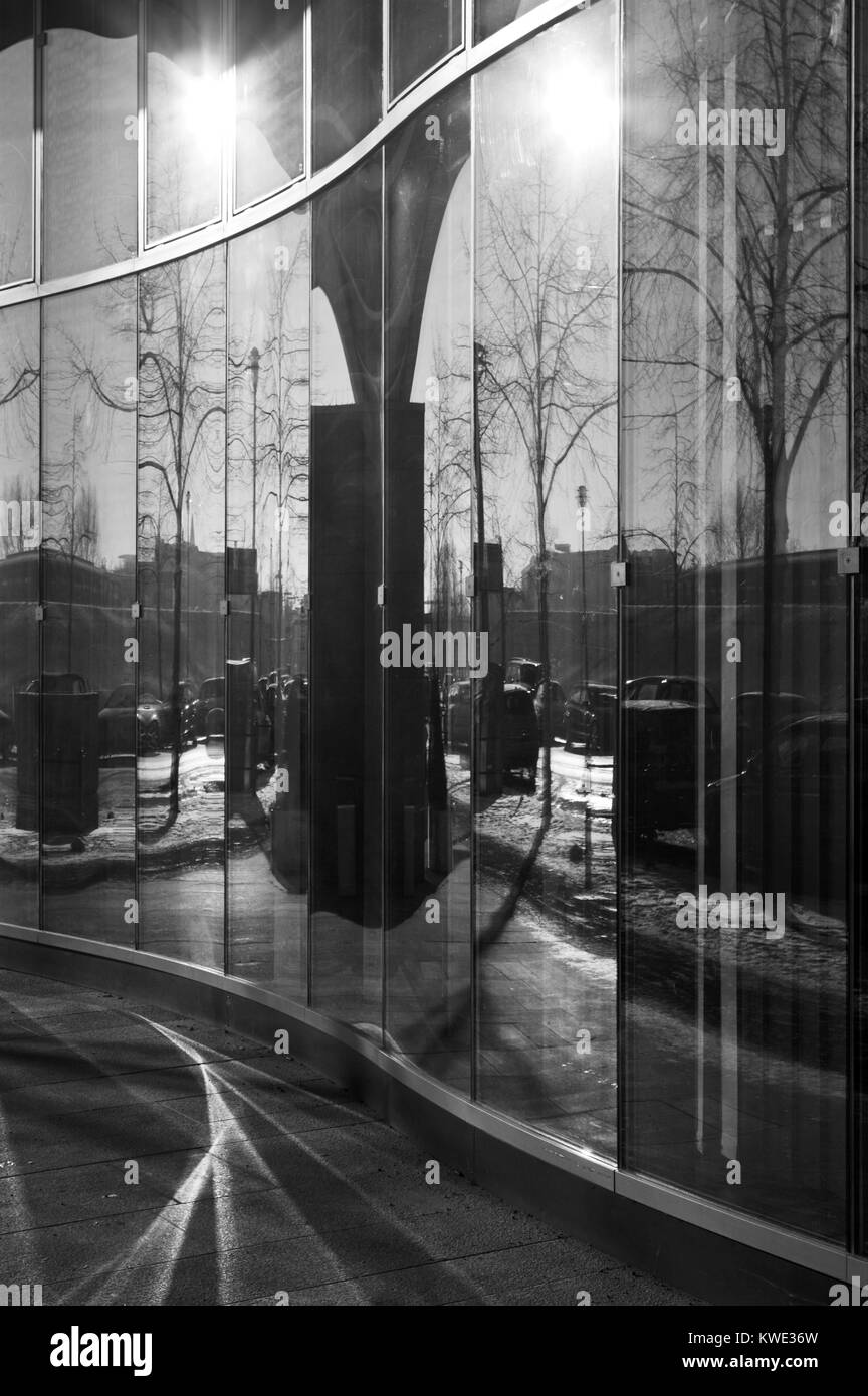 Wavy glass architecture reflecting the sunlight. Stock Photo