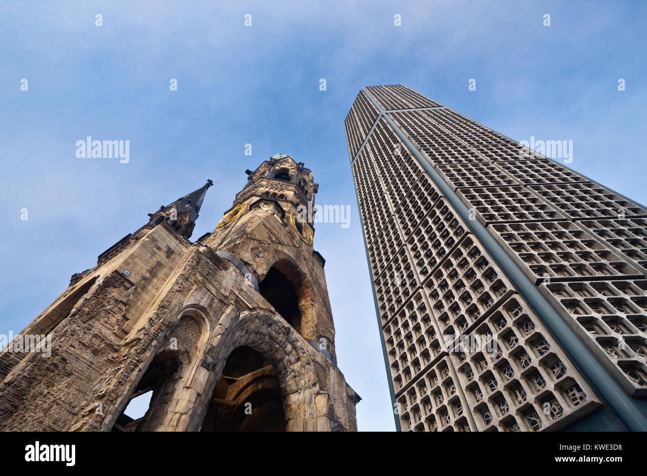 Wide angle view of the Kaiser Wilhelm Memorial Church in Berlin with blue sky. Stock Photo