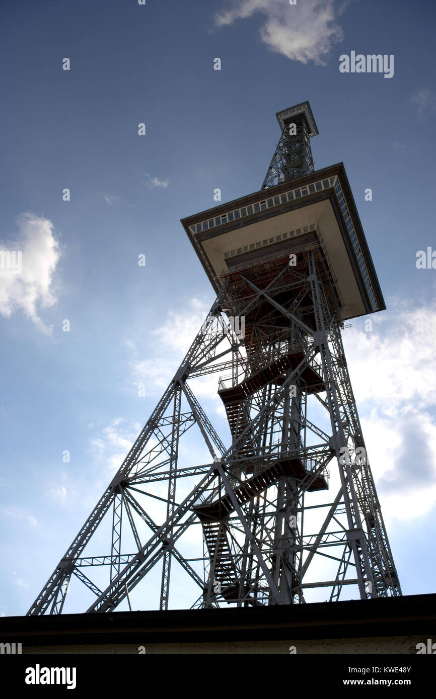 The 'Funkturm' (radio tower) in the west of Berlin against the sun. It looks like a small version of the Eiffel Tower and has a total height of 150m w Stock Photo