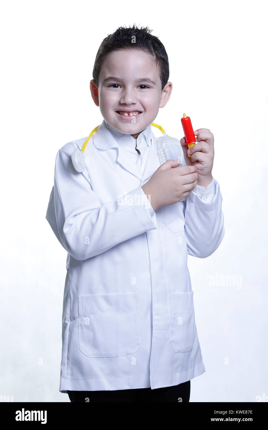 happy child wearing medical clothes and toy instruments Stock Photo Alamy