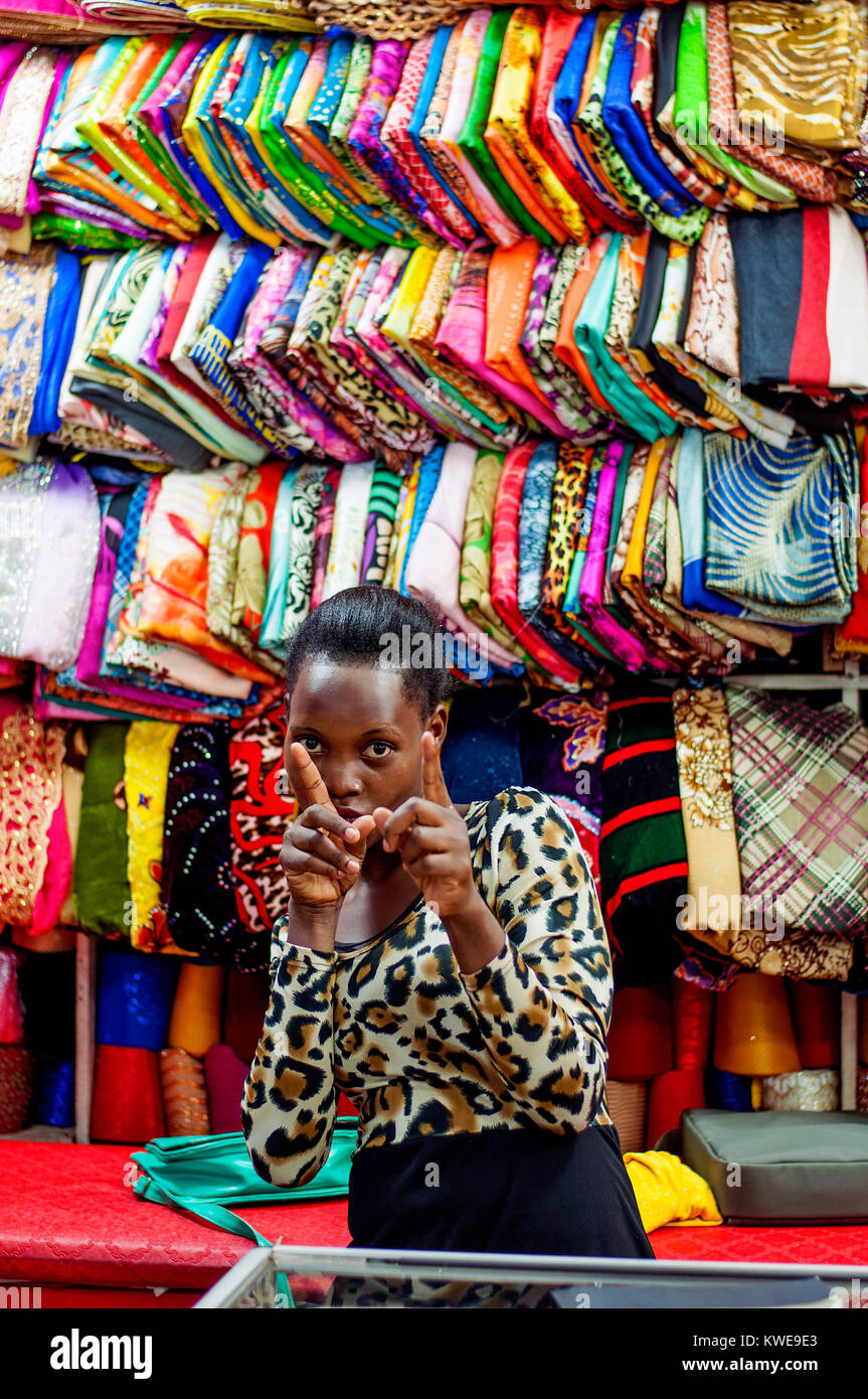 Shop assistant in an African-syle boutique, shopping mall, Kampala, Uganda Stock Photo