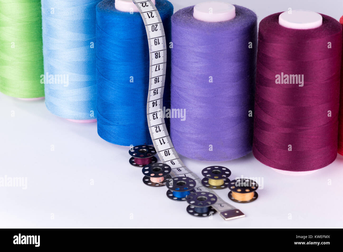 Tailor supplies; yarn coils, mesure and rollers Stock Photo