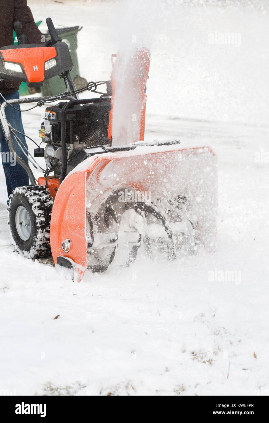 Clearing the snow using a home snow blower. Stock Photo