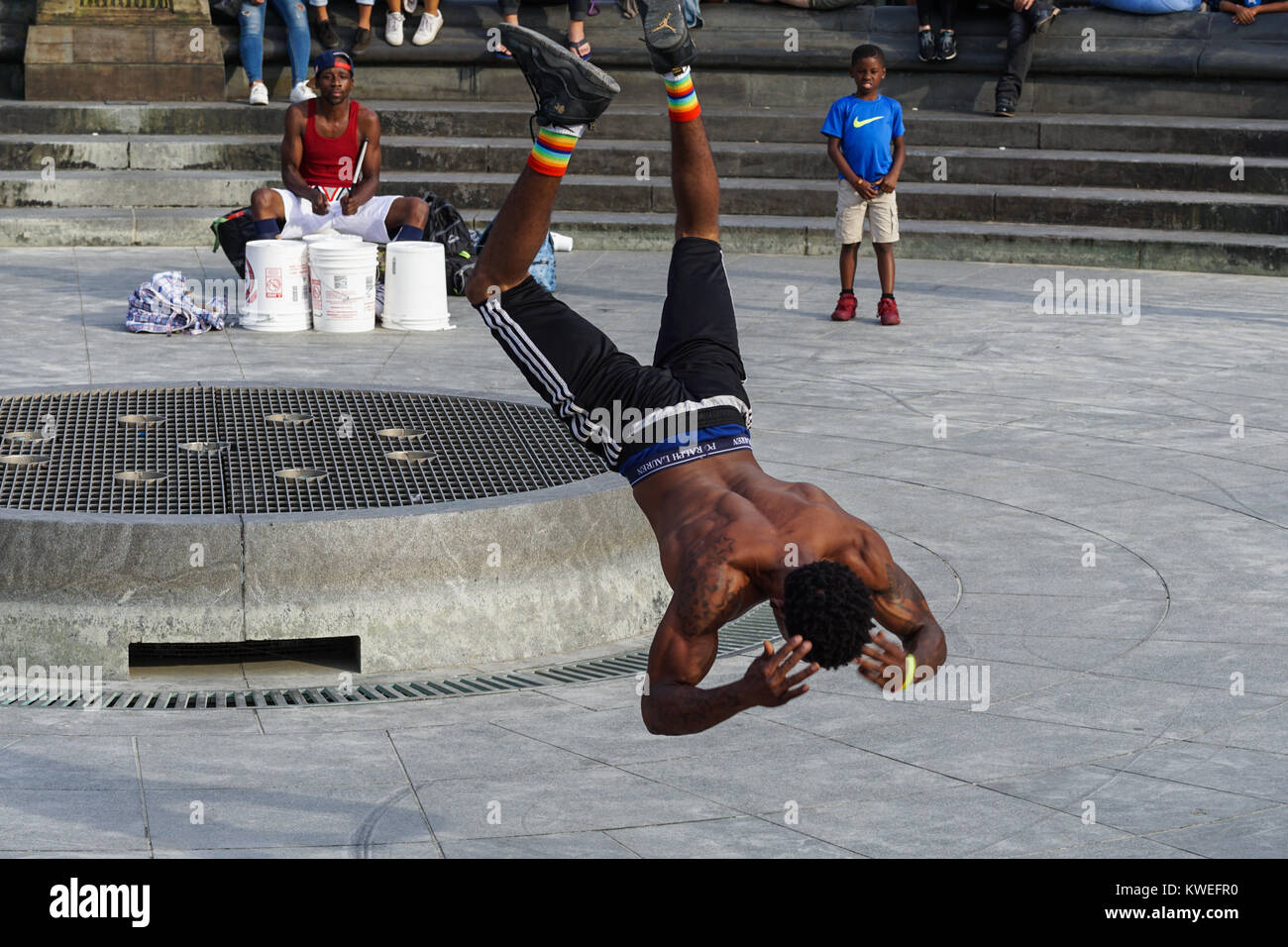 Acrobatic street performance in Greenwich Village's Washington Square Park, New York City. Stock Photo