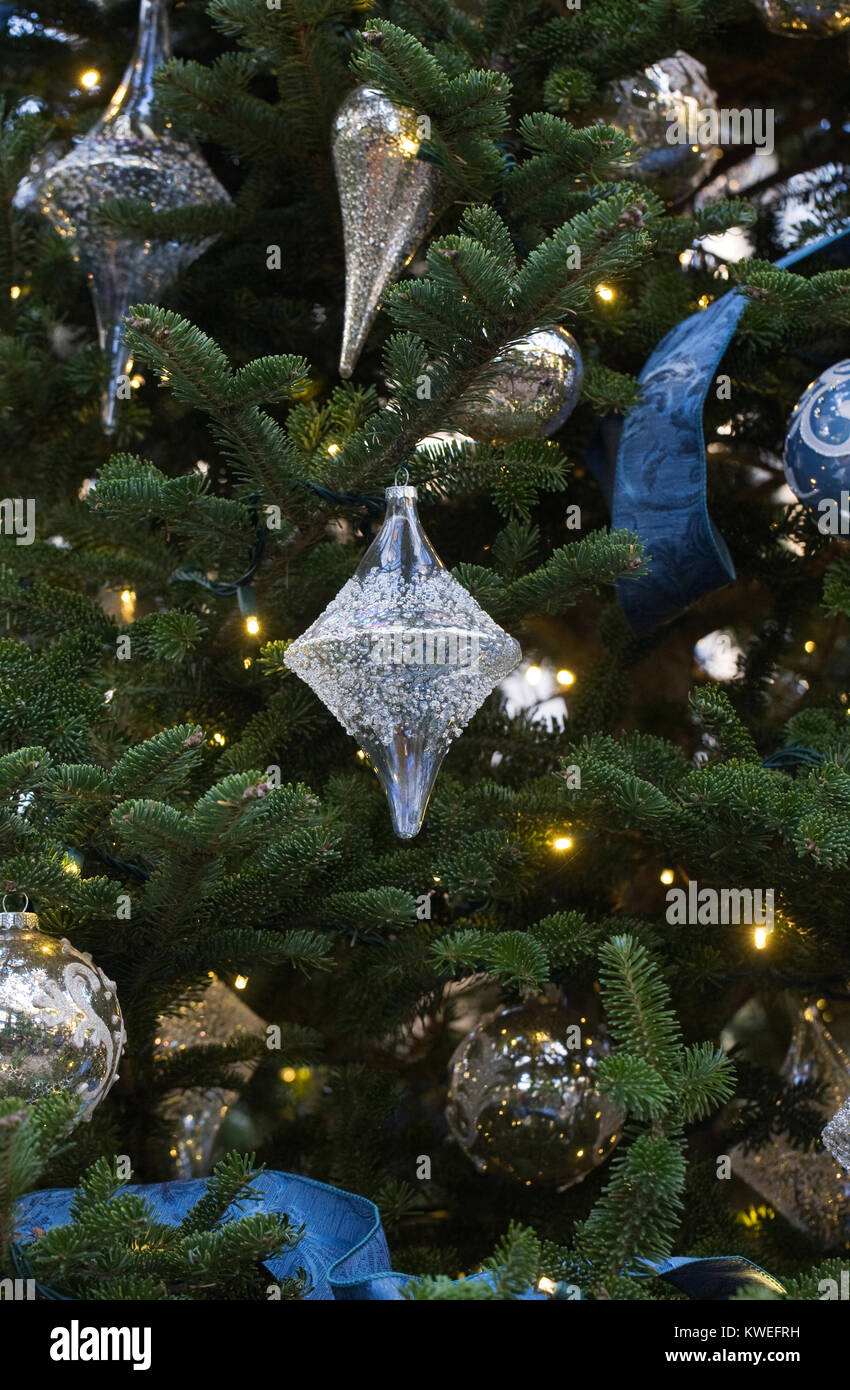 Decorative baubles on a Christmas tree. Stock Photo