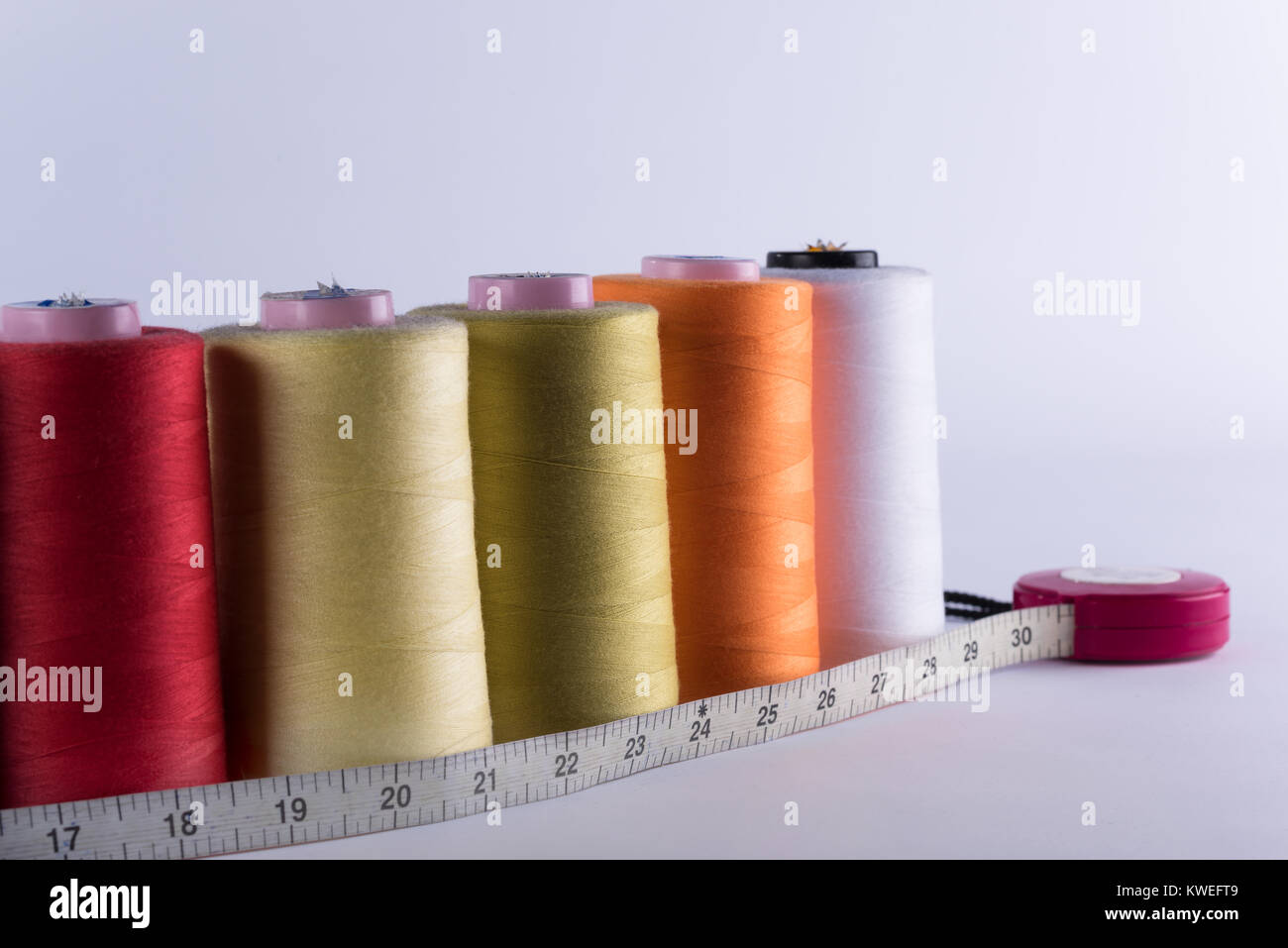 Tailor supplies; yarn coils, mesure and rollers Stock Photo