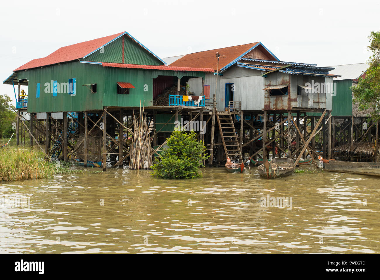 Wood and metal settlement, group of houses buildings on stilts, Kampong Phluk floating village, Tonle Sap Lake, Siem Reap, Cambodia, South East Asia Stock Photo