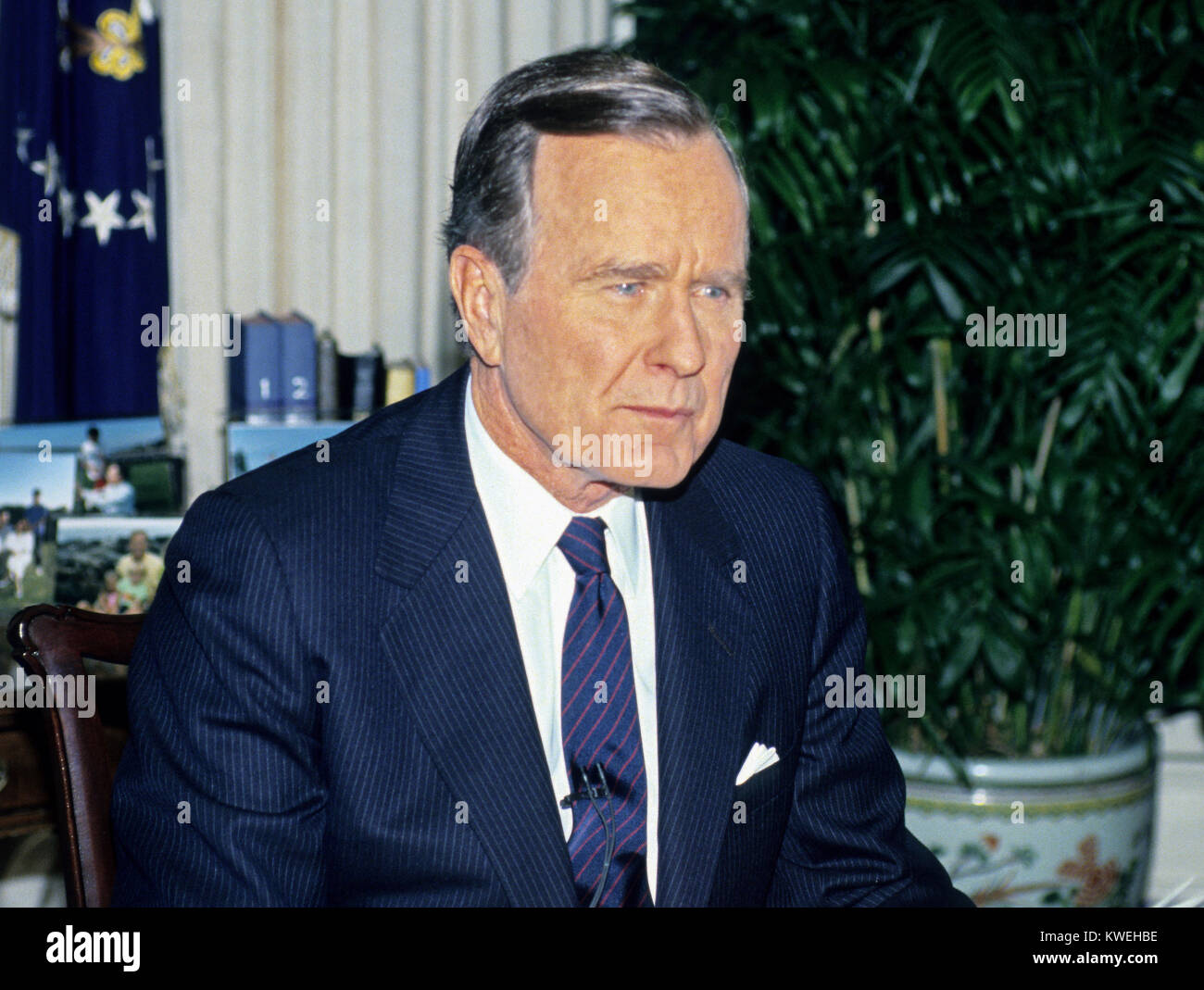 United States President George H.W. Bush poses for photos in the Oval Office of the White House in Washington, D.C. after announcing the start of the air offensive to liberate Kuwait after it was overrun by Iraq on January 16, 1991. Credit: Ron Sachs / CNP /MediaPunch Stock Photo