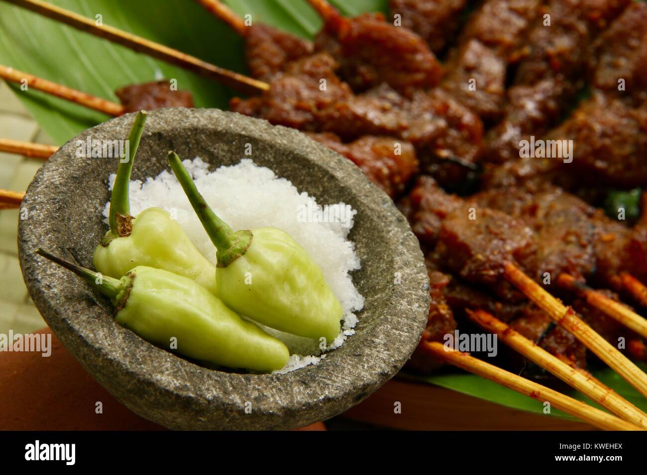 Sea Salt and Green Chili Peppers. The condiment for Balinese pork satay. Stock Photo