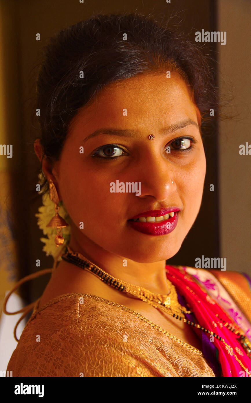 Close-up of Maharashtrian woman wearing saree and jewellery, Pune Stock Photo