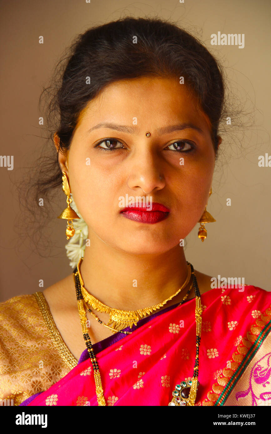 Close-up of Maharashtrian woman wearing saree and jewellery, Pune Stock Photo