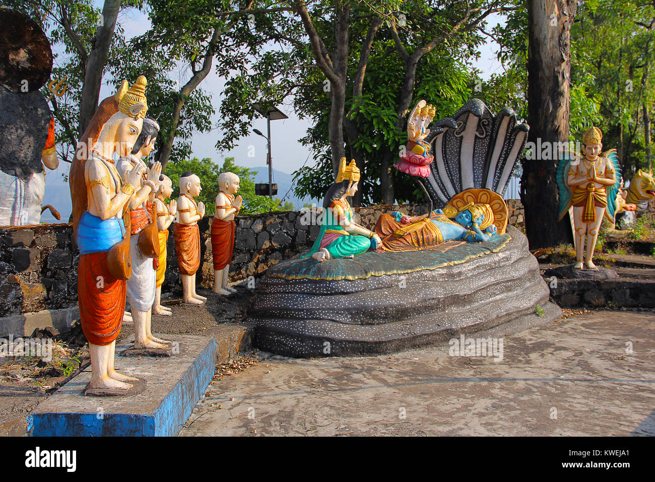 Statue of Lord Vishnu resting on Sheshnaag (snake), with wife Lakshmi sitting and Lord Brahma, Nilkantheshwar Temple, Panshet, Pune Stock Photo