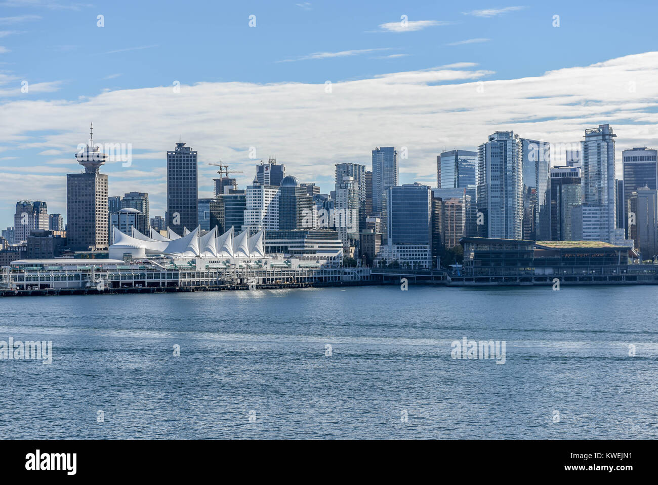 Port of Vancouver British Columbia in summer on a sunny day - Canada Place w/ a sea plane - seaplane - ships, boats and Modern Vancouver City Stock Photo