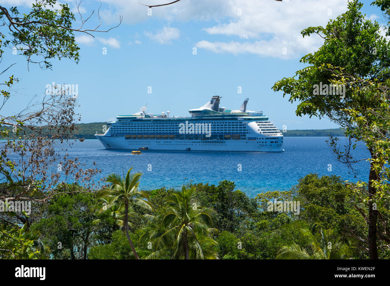 Voyager of the Seas anchored in Santal Bay, Lifou. Stock Photo
