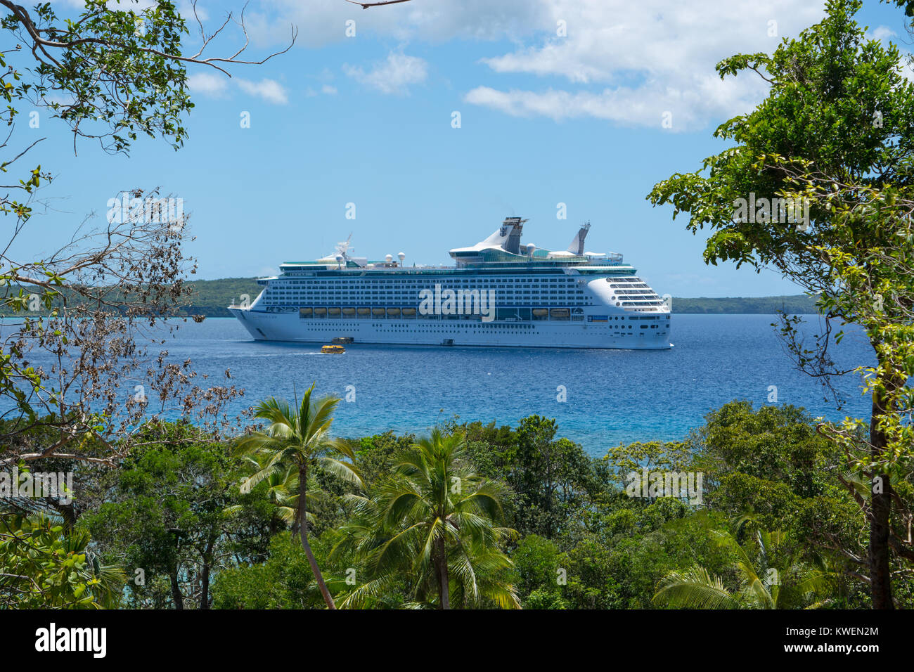Voyager of the Seas anchored in Santal Bay, Lifou. Stock Photo