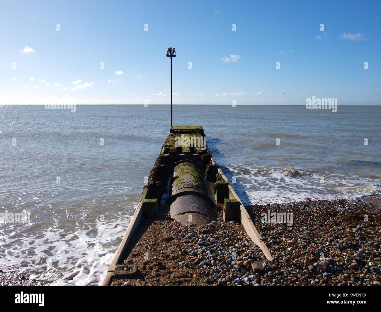Storm drain outlet to sea Stock Photo
