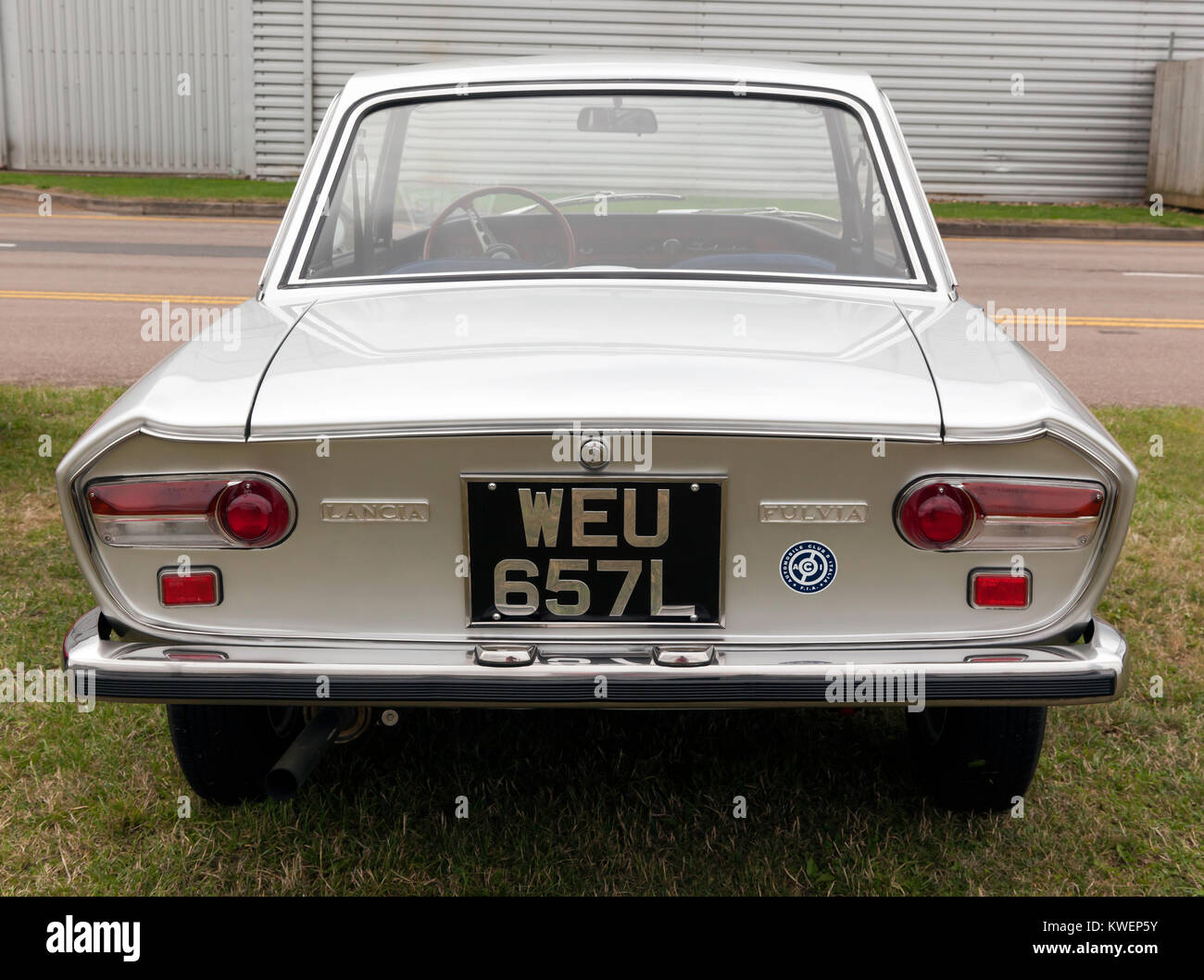 Rear view of a silver 1973 Lancia Fulvia, 1.3S Coupe, on display